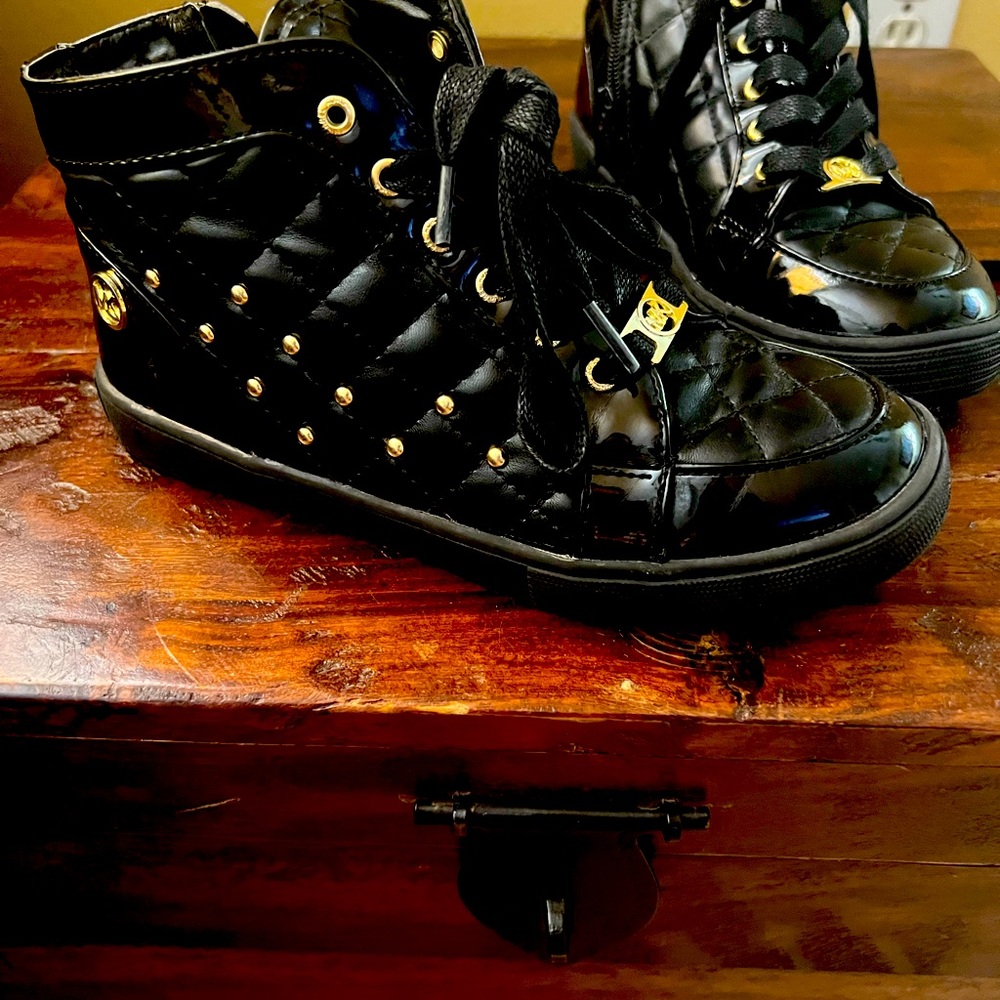 Black and gold Michael Kors grade school sneakers